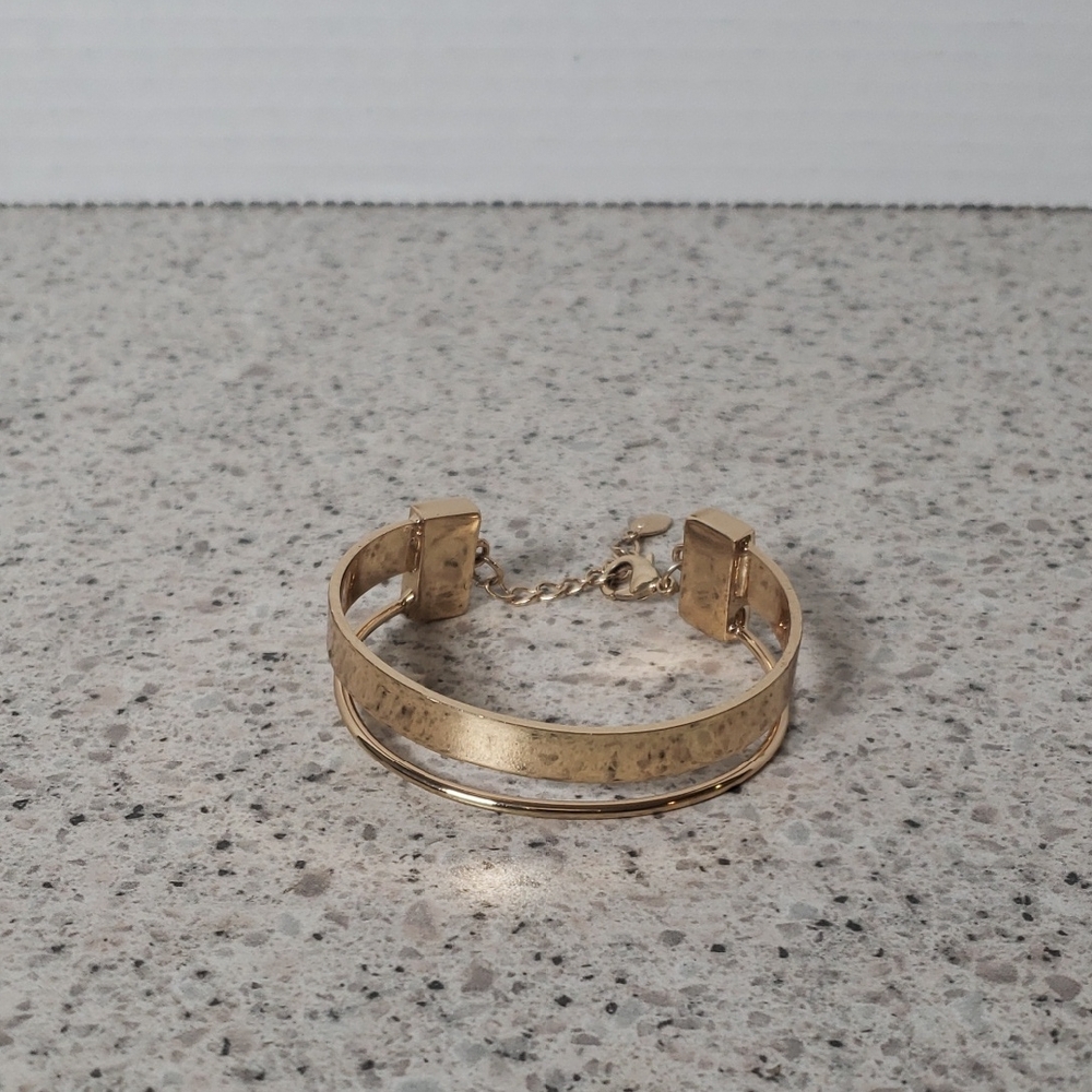 Gold-Tone Bangle Bracelet‎ with Safety Chain